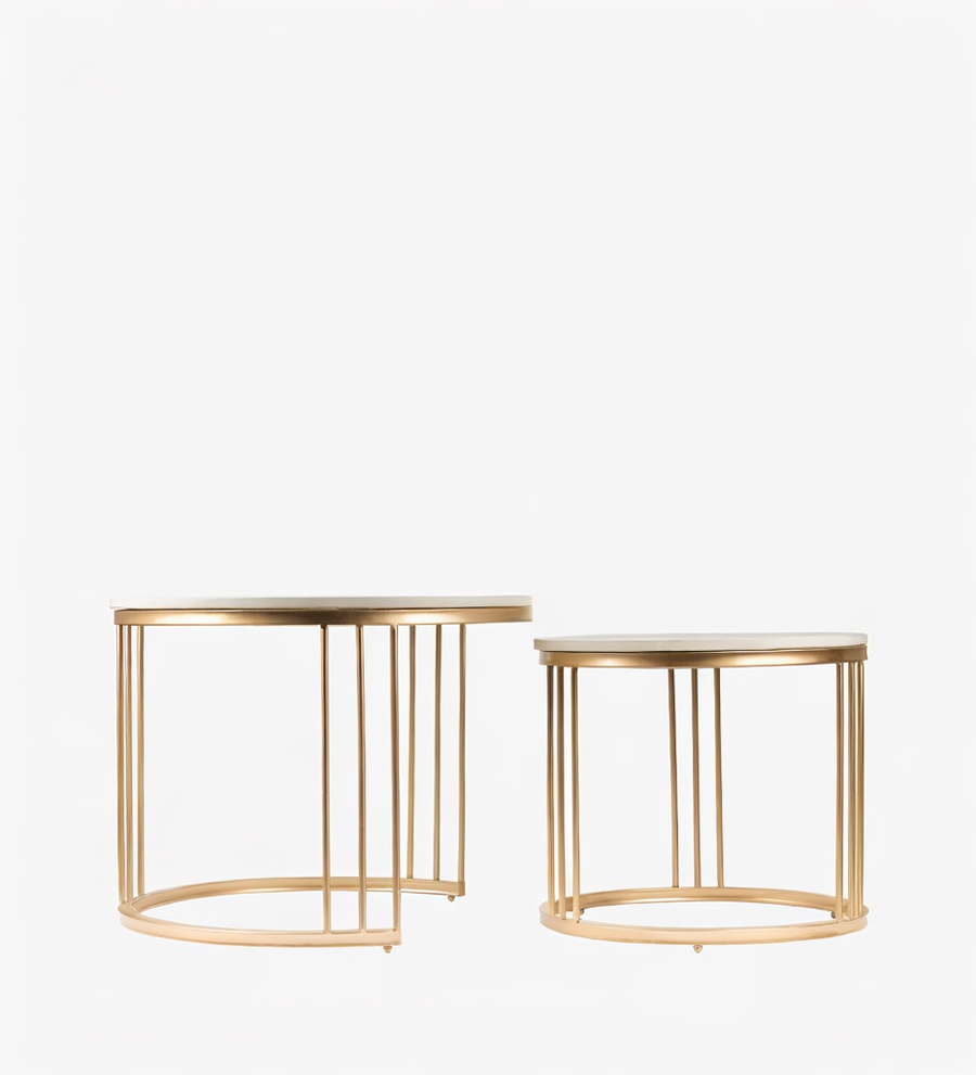 Two gold metal side tables on a white background